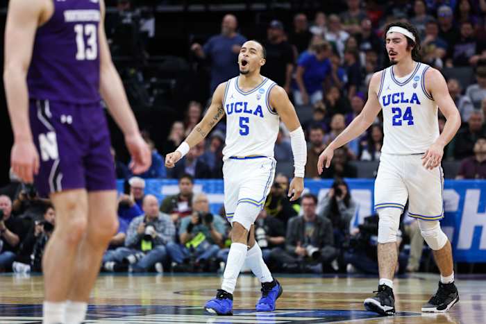 Amari Bailey and Jaime Jacquez Jr. walk down the court.